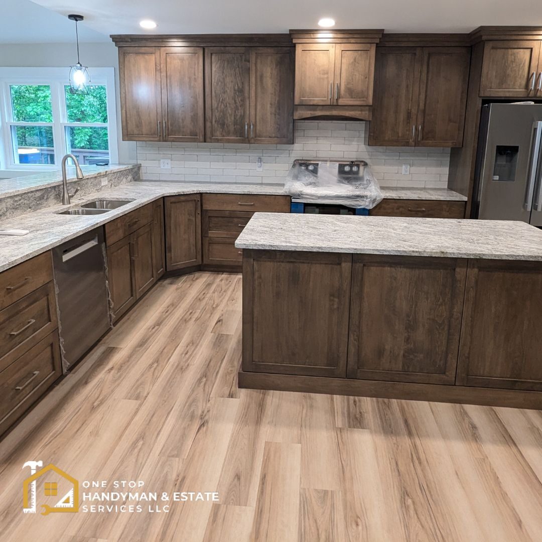 new kitchen renovations A newly renovated kitchen with brown cabinets and stone counter tops.